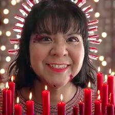 A surreal scene featuring a woman smiling and standing confidently in the center of a circle made of bright orange Cheetos and flickering candles