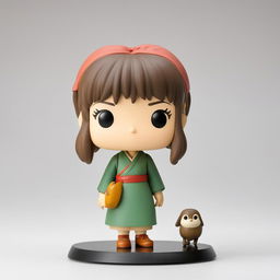 A Studio Ghibli-themed Funko Pop vinyl figure of Chihiro from 'Spirited Away', standing against a white background.