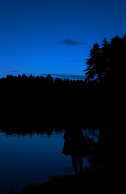 A serene lake at dusk, with a dark, mysterious atmosphere