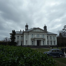 A detailed and atmospheric depiction of the Ipatiev House in Yekaterinburg, Russia, focusing on its historical architecture and somber ambiance