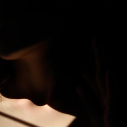 A dramatic and moody scene featuring a man's hand resting on a woman's neck in a dark, mysterious setting