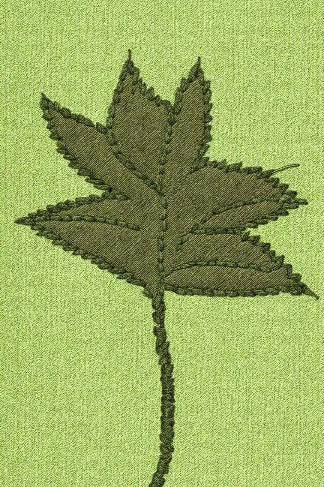 A high-resolution digital image of a minimalist embroidery design on fabric, featuring a leaf