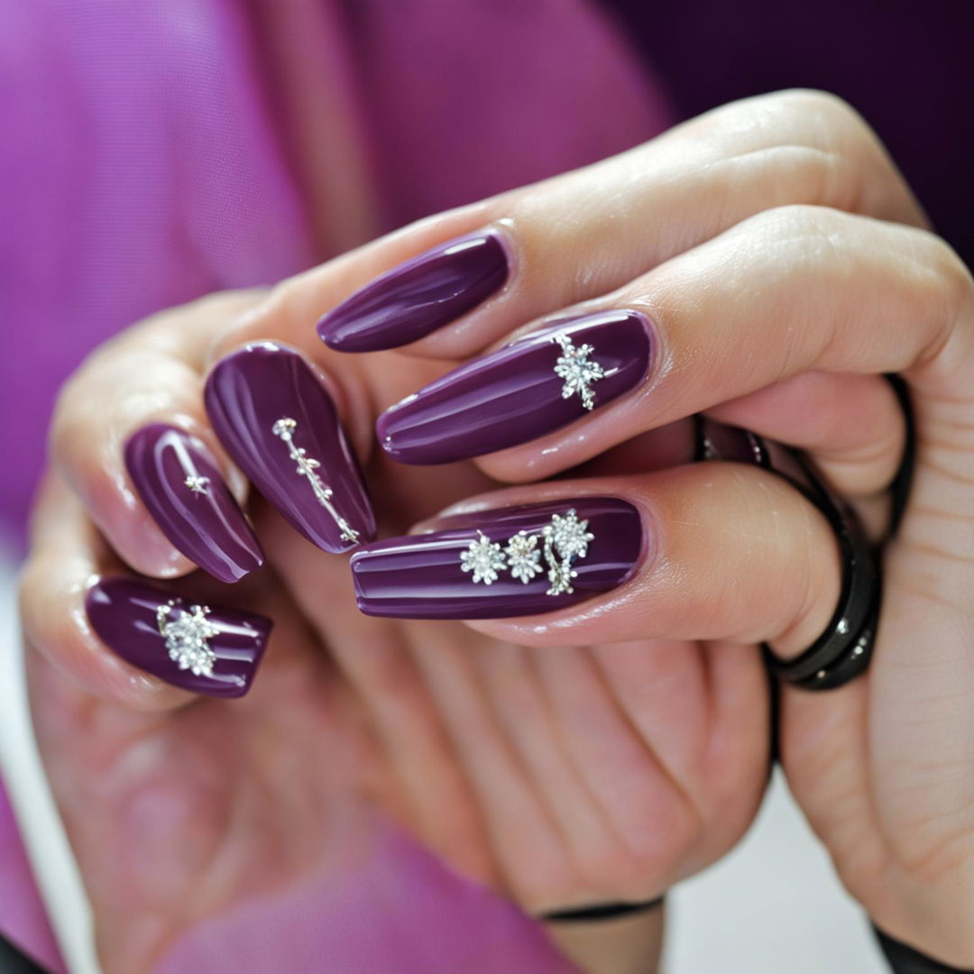 A high-definition, close-up image of a hand with nails painted in a glossy lavender color and adorned with delicate nail charms