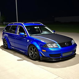 A blue 2001 widebody VW Passat R36 wagon modified for drifting, featuring an eye-catching race livery and a stylish carbon hood