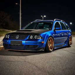 A blue 2001 widebody VW Passat R36 wagon drift car parked at night, shown from a higher 3/4 front view to emphasize the carbon hood