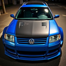 A blue 2001 widebody VW Passat R36 L wagon modified as a drift car, featuring a carbon fiber hood and aggressive aerodynamic enhancements