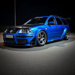 A blue 2001 VW Passat R36 L wagon drift car with a wide body kit and gender flares, featuring a striking racing livery and a carbon hood