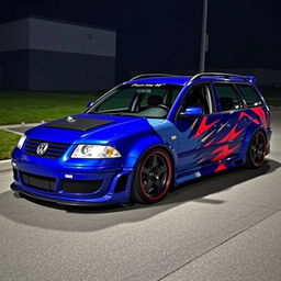A blue 2001 VW Passat R36 L wagon designed as a drift car, featuring noticeable fender flares and an aggressive body kit with a dramatic aero design