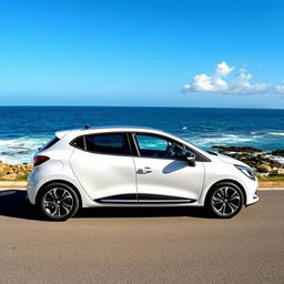 A sleek, modern Renault Clio in a bright white color parked on a scenic coastal road