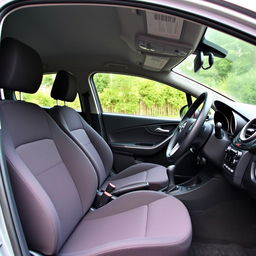 the interior of a 2015 Opel Corsa, featuring a compact and modern design with comfortable fabric seats, an intuitive dashboard with easy-to-read dials and an integrated infotainment system