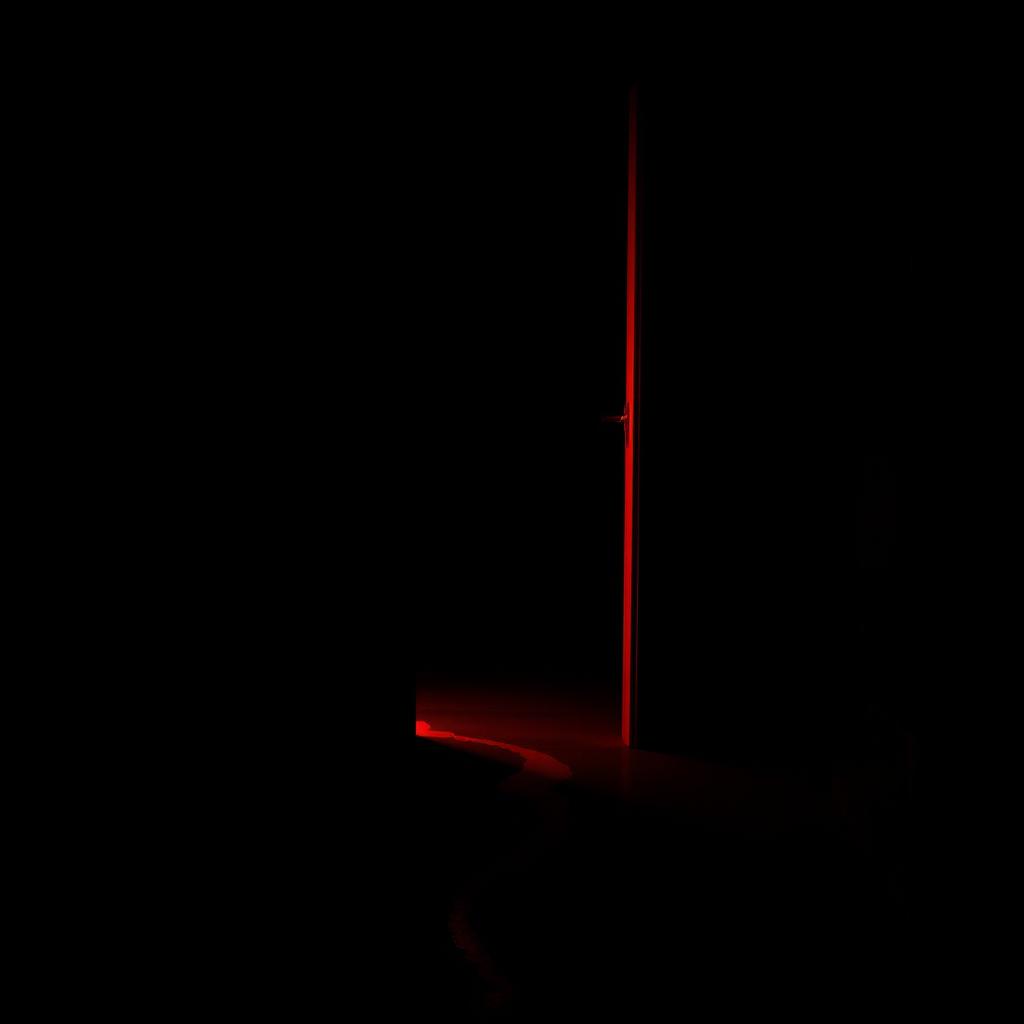 A black dark room featuring a slightly open door, with a vivid red light streaming out from the gap