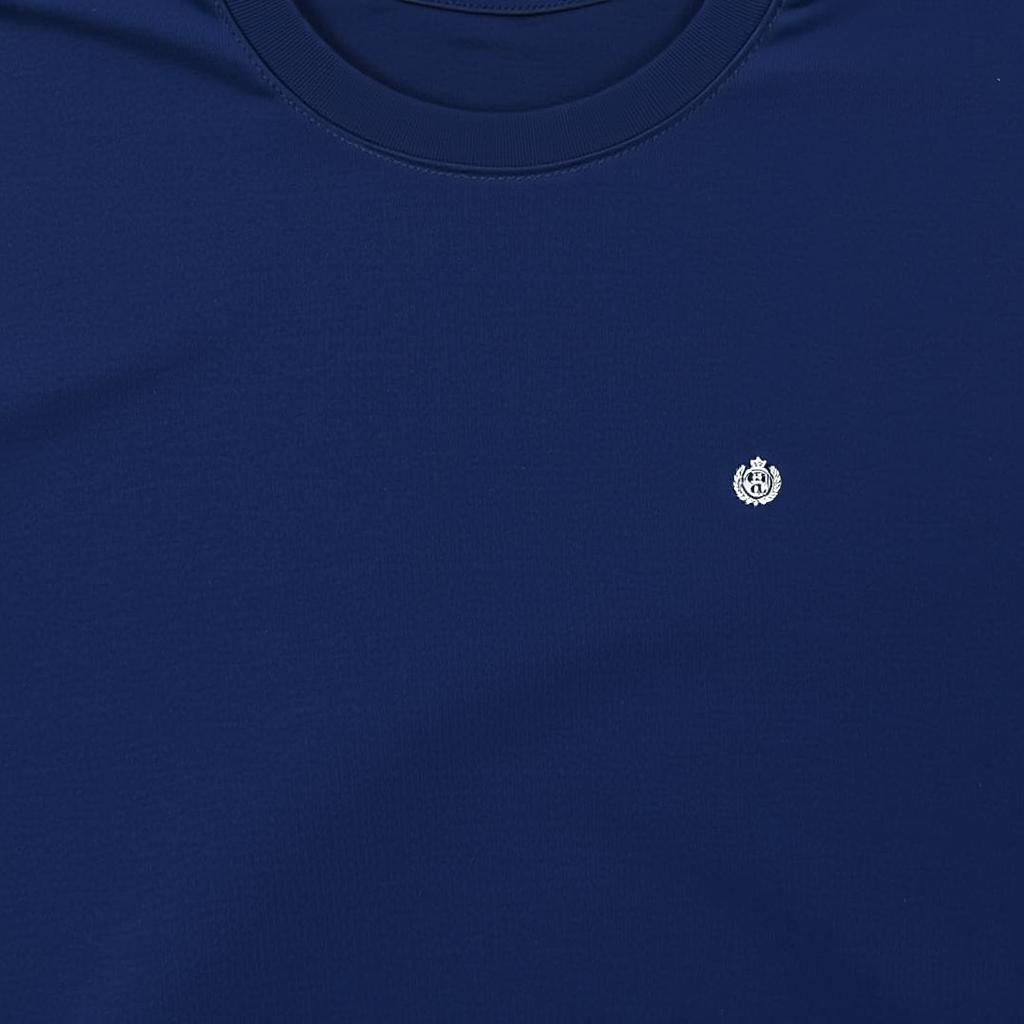 A half-size t-shirt in navy blue color, featuring a small-sized National Service Scheme logo placed on the left side of the front