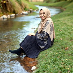A girl wearing a luxurious hijab and a beautifully patterned abaya sits gracefully on the grass beside a tranquil water stream