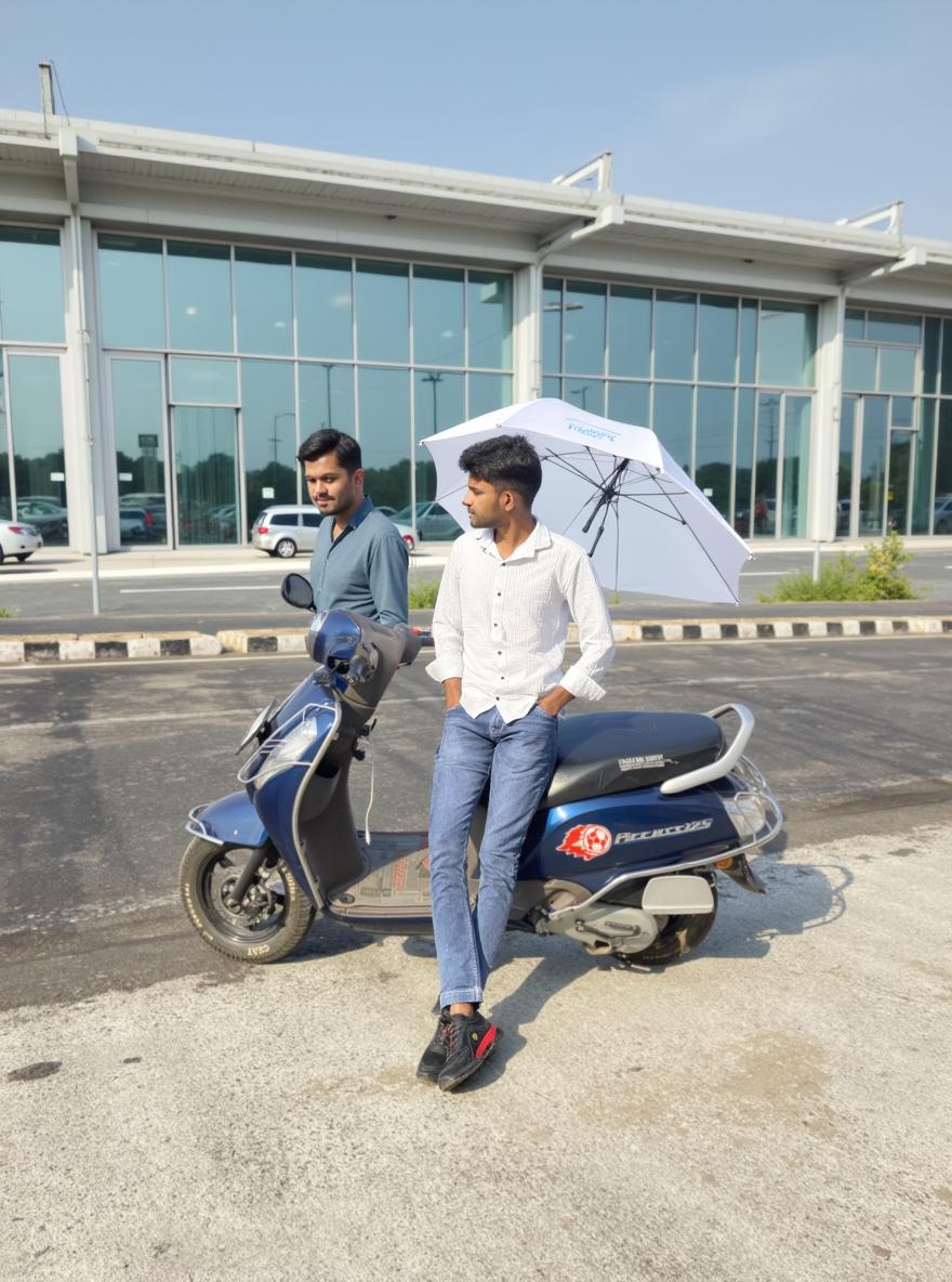 A young man leaning casually against a blue scooter, dressed in a white shirt and denim jeans