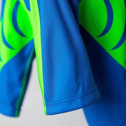 A close-up of a vibrant blue and green sports jersey, featuring bold patterns and high-quality fabric textures