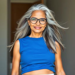 A beautiful and confident dusky Indian woman, aged 60, with long grey hair flowing elegantly, wearing stylish glasses