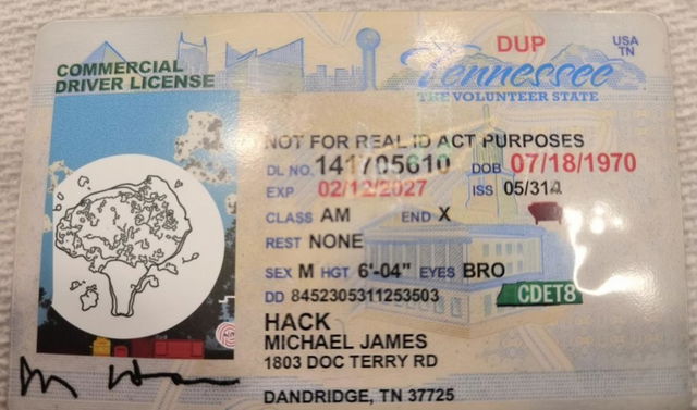 A realistic and detailed depiction of a Tennessee commercial driver license