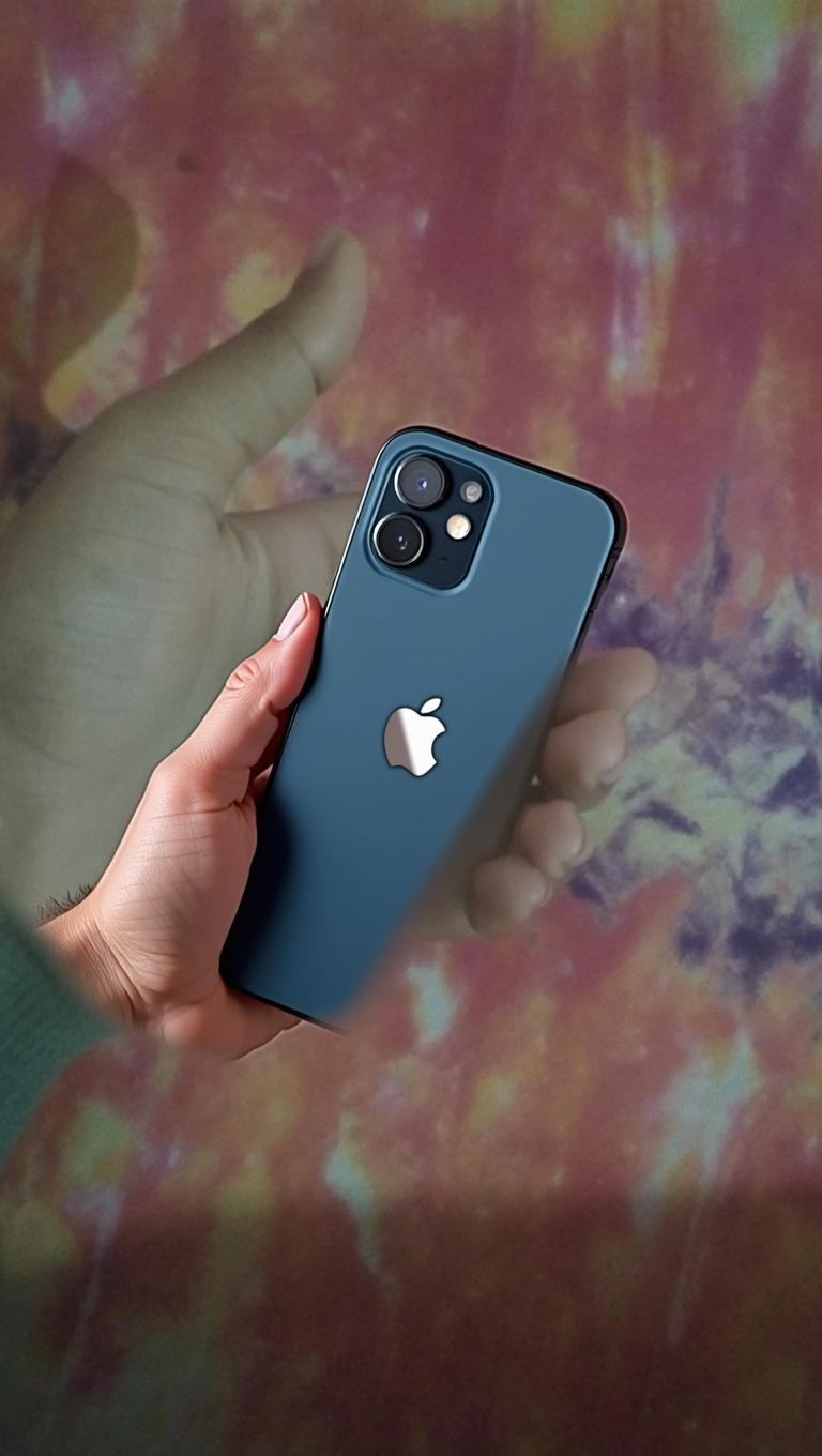 An open hand reaching out, against a vibrant, colorful tie-dye background with orange, pink, and purple hues