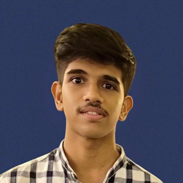 A close-up portrait of a teenage boy with a thoughtful expression, raising his left eyebrow playfully