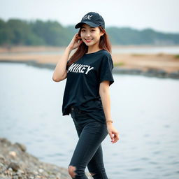 A beautiful Korean woman posing gracefully and attractively while wearing a black t-shirt featuring Mikey's text