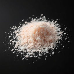 A heap of pink salt powder scattered on a surface, with no other objects in the image