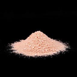 A heap of pink salt powder, vibrant in color, completely spread out, occupying the foreground of the image
