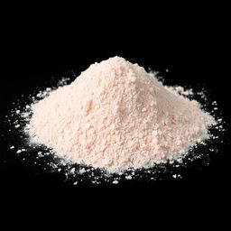 A mound of very fine pink salt powder, completely powdered with no lumps visible, spread evenly on the ground