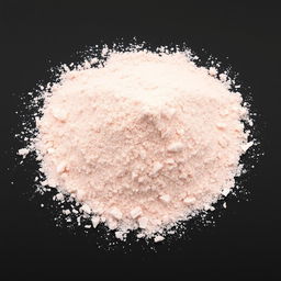 A mound of very fine pink salt powder, completely powdered with no lumps visible, spread evenly on the ground