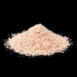 A heap of finely crushed pink salt powder with small crystalline grains, showcasing a beautiful blend of red, pink, and white hues