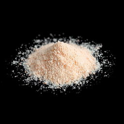 A close-up view of a mound of pink salt powder, finely ground with tiny crystals that are not individually visible, showcasing a gradient of red, pink, and white hues
