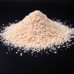 A mound of pink salt powder scattered on a flat surface, with the grains appearing very fine and crystalline, showcasing a color range predominantly in reds, pinks, and whites