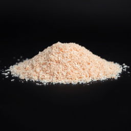 A close-up view of a mound of fine pink salt powder, with crystal-like, glassy grains that are not visible to the naked eye