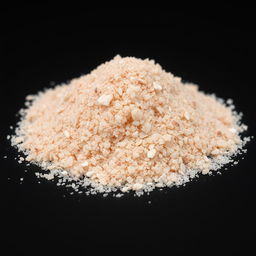A close-up view of a mound of fine pink salt powder, with crystal-like, glassy grains that are not visible to the naked eye