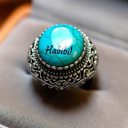 A beautifully crafted turquoise ring featuring intricate detailing and the engraved names 'Habib' and 'Hussein' in elegant calligraphy