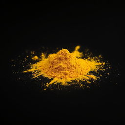 A mound of turmeric powder scattered on a flat surface, viewed from the front