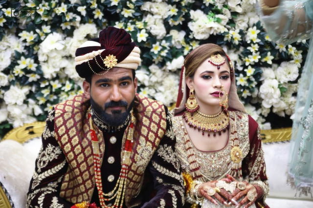 A beautifully styled portrait of a couple during a traditional wedding ceremony