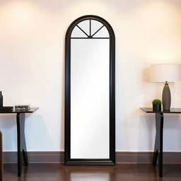 A tall, elegant mirror with a sleek black frame, positioned between two tables