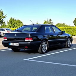 A black Citroën Xantia parked in a parking lot