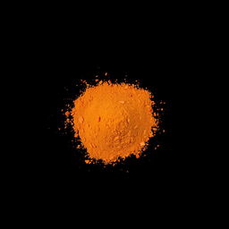 A medium amount of paprika powder with small pieces of chopped red bell pepper visible, scattered in a heap on the ground