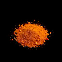 A medium amount of paprika powder with small pieces of chopped red bell pepper visible, scattered in a heap on the ground