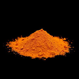 A medium amount of paprika powder with finely ground pieces of red bell pepper visible, scattered in a heap on the ground