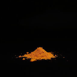 An image of a moderate amount of paprika powder spilled in a mound on the ground, without any other objects in the scene