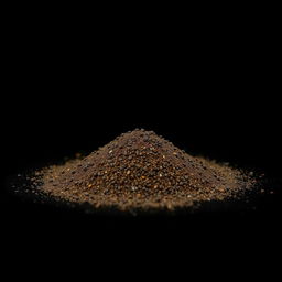 An image of a mound of black pepper powder spilled on the ground, with no other objects present in the scene