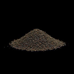 A mound of finely ground black pepper resting on a flat surface, with the mound clearly defined and isolated
