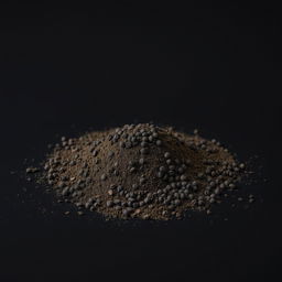 A mound of finely ground black pepper powder scattered on a plain, completely black background