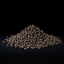 A mound of whole black peppercorns spilling on a flat surface, with no other objects in the image