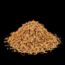A mound of shredded cinnamon tree bark scattered on the ground, with no other objects in the image