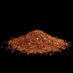A pile of pul biber (red pepper flakes) scattered on the ground, viewed from a completely front angle