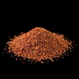 A pile of pul biber (red pepper flakes) scattered on the ground, viewed from a completely front angle