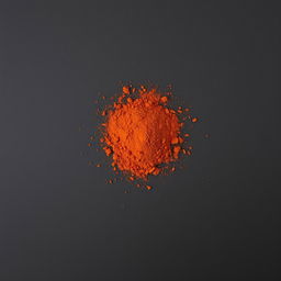 A heap of dried and ground red chili pepper scattered on a completely black background, viewed straight on, with no other objects present